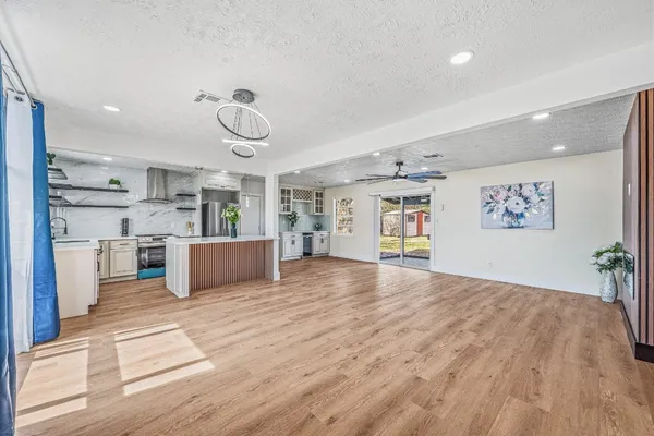 a view of a kitchen with microwave and cabinets