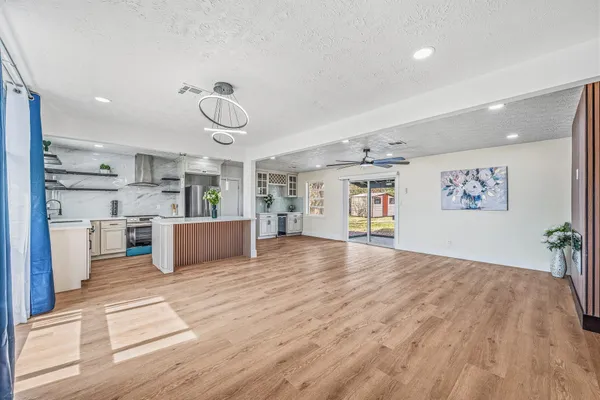 a view of a kitchen with microwave and cabinets