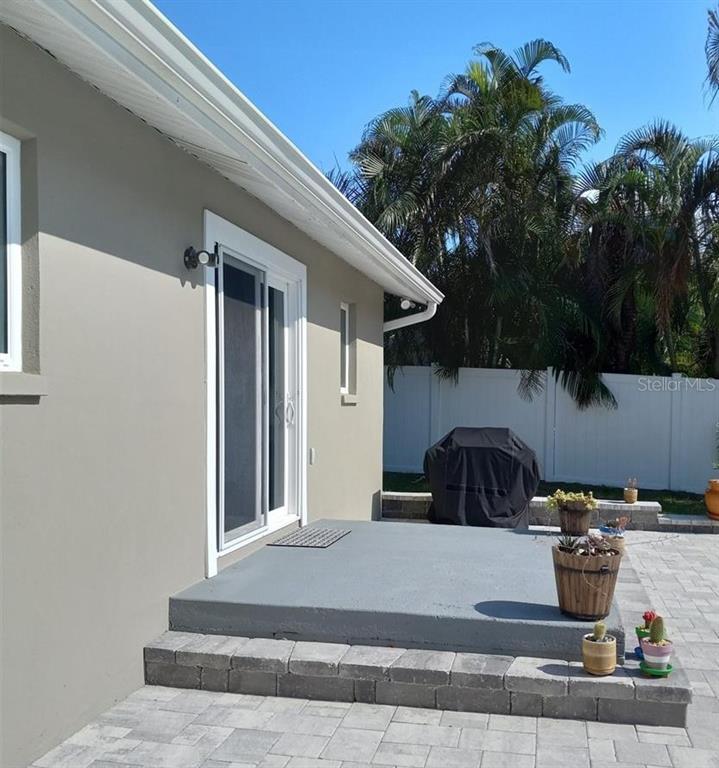12932 81st Avenue Seminole, FL 33776 - Photo 24 of 27 a view of a two chairs in the patio