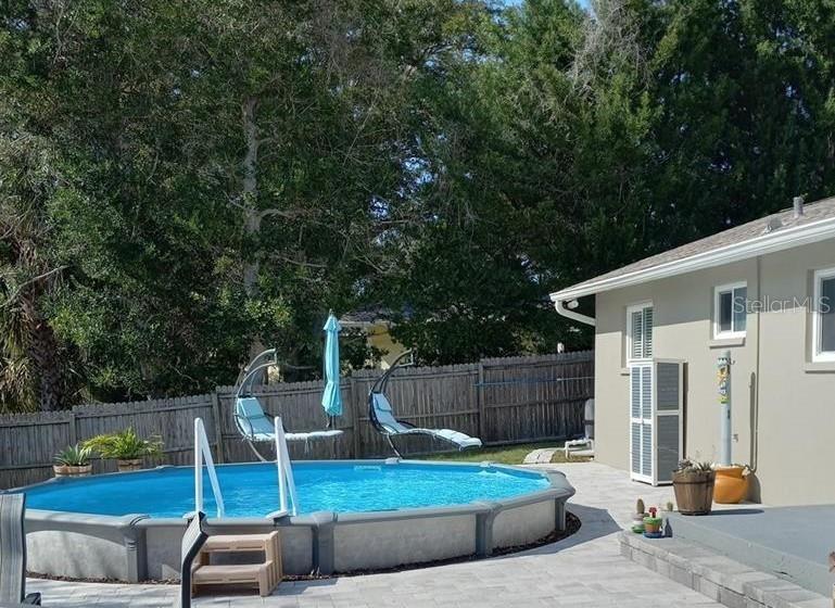 12932 81st Avenue Seminole, FL 33776 - Photo 25 of 27 a view of backyard with small cabin