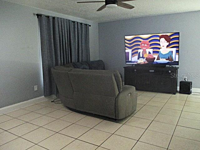 12932 81st Avenue Seminole, FL 33776 - Photo 3 of 27 a living room with furniture and wall paintings