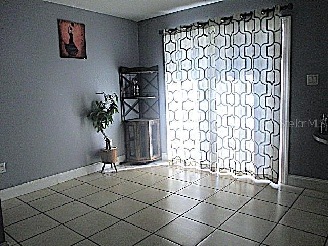 12932 81st Avenue Seminole, FL 33776 - Photo 4 of 27 a view of entryway with wooden floor
