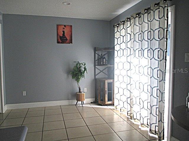 12932 81st Avenue Seminole, FL 33776 - Photo 7 of 27 a view of an empty room and window