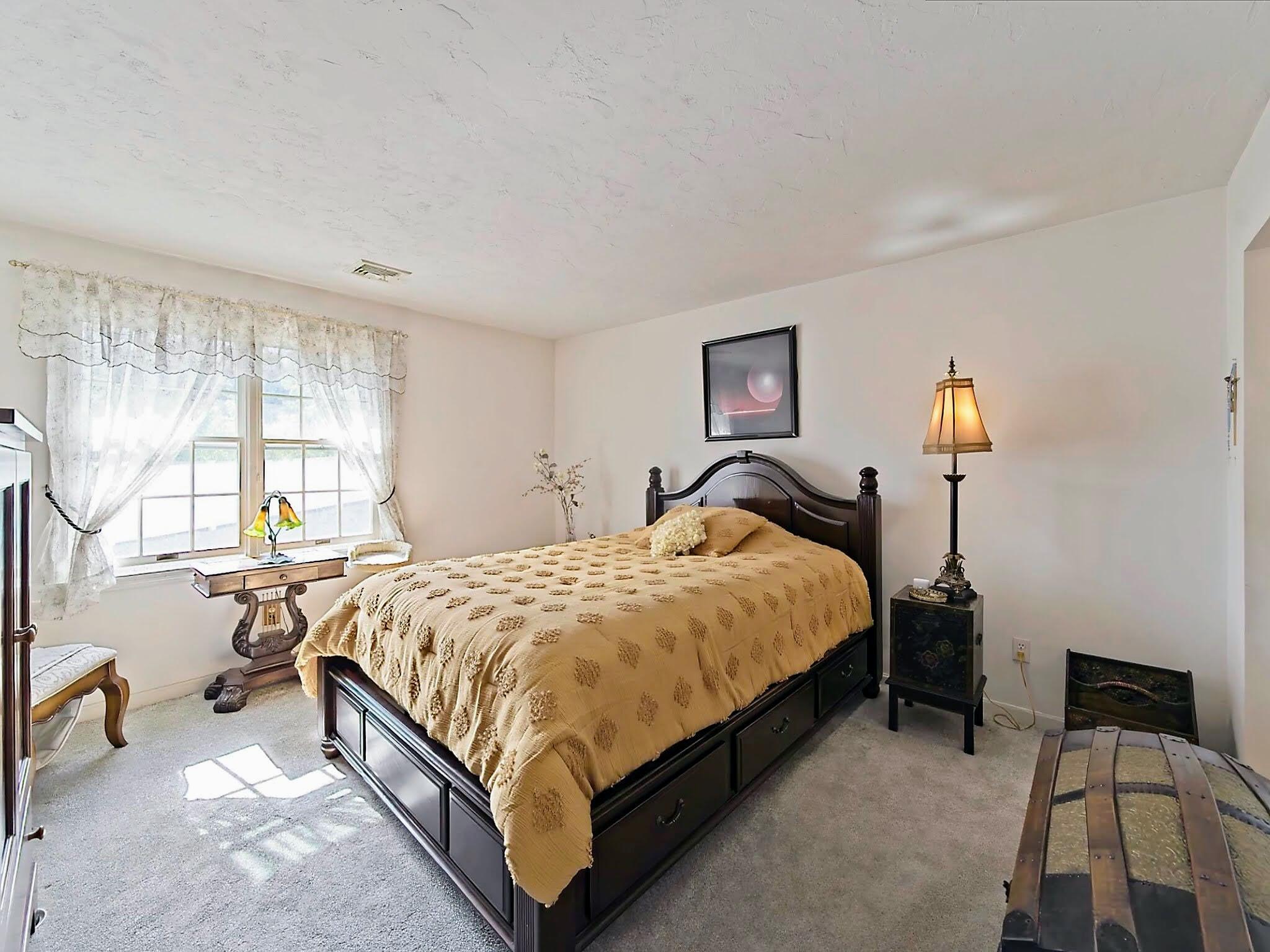 700 Shore Drive, Unit 1205 Fall River, MA 02721 - Photo 15 of 22 a spacious bedroom with a bed and a window