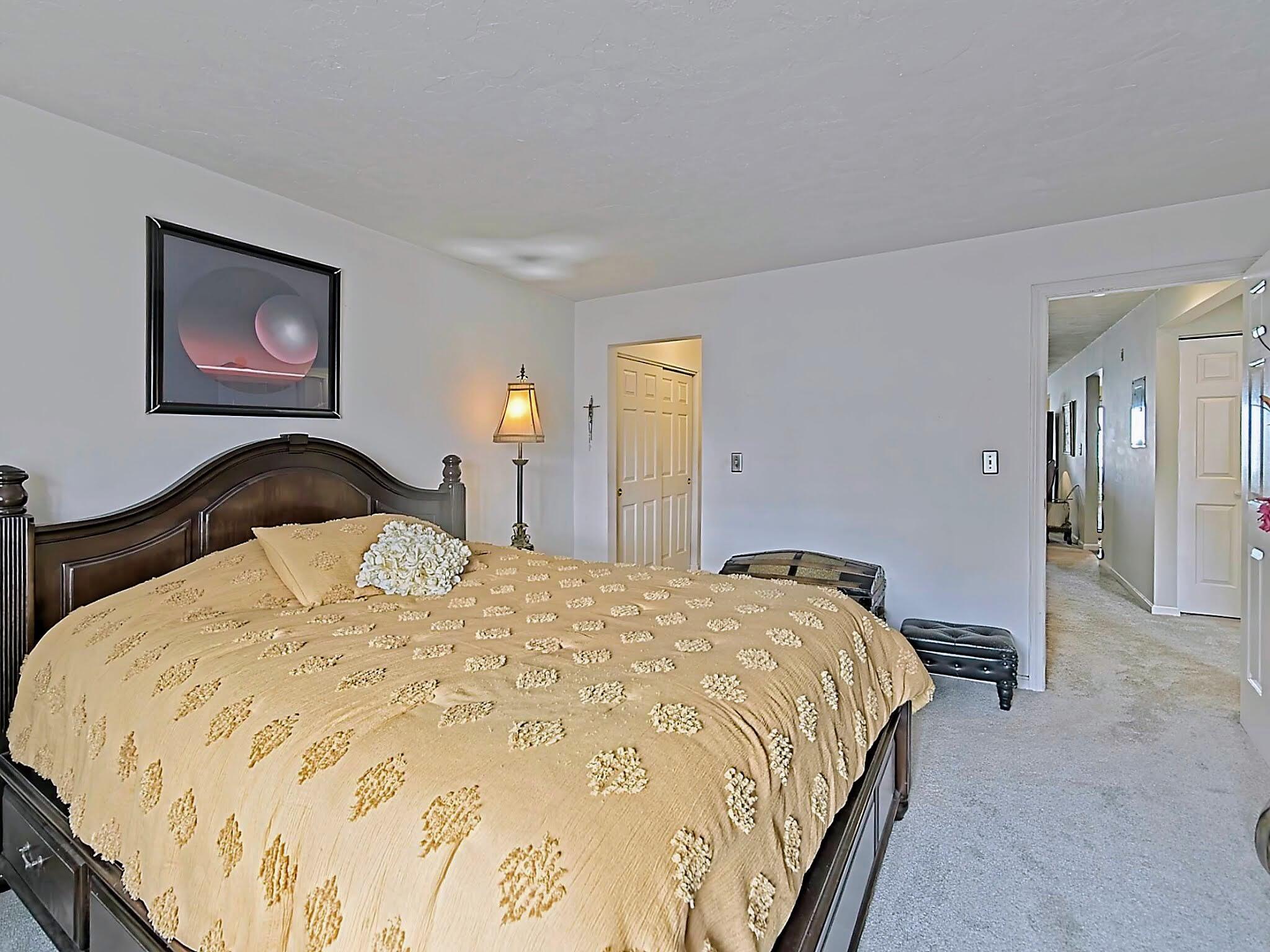 700 Shore Drive, Unit 1205 Fall River, MA 02721 - Photo 16 of 22 a bedroom with a bed and a painting on the wall