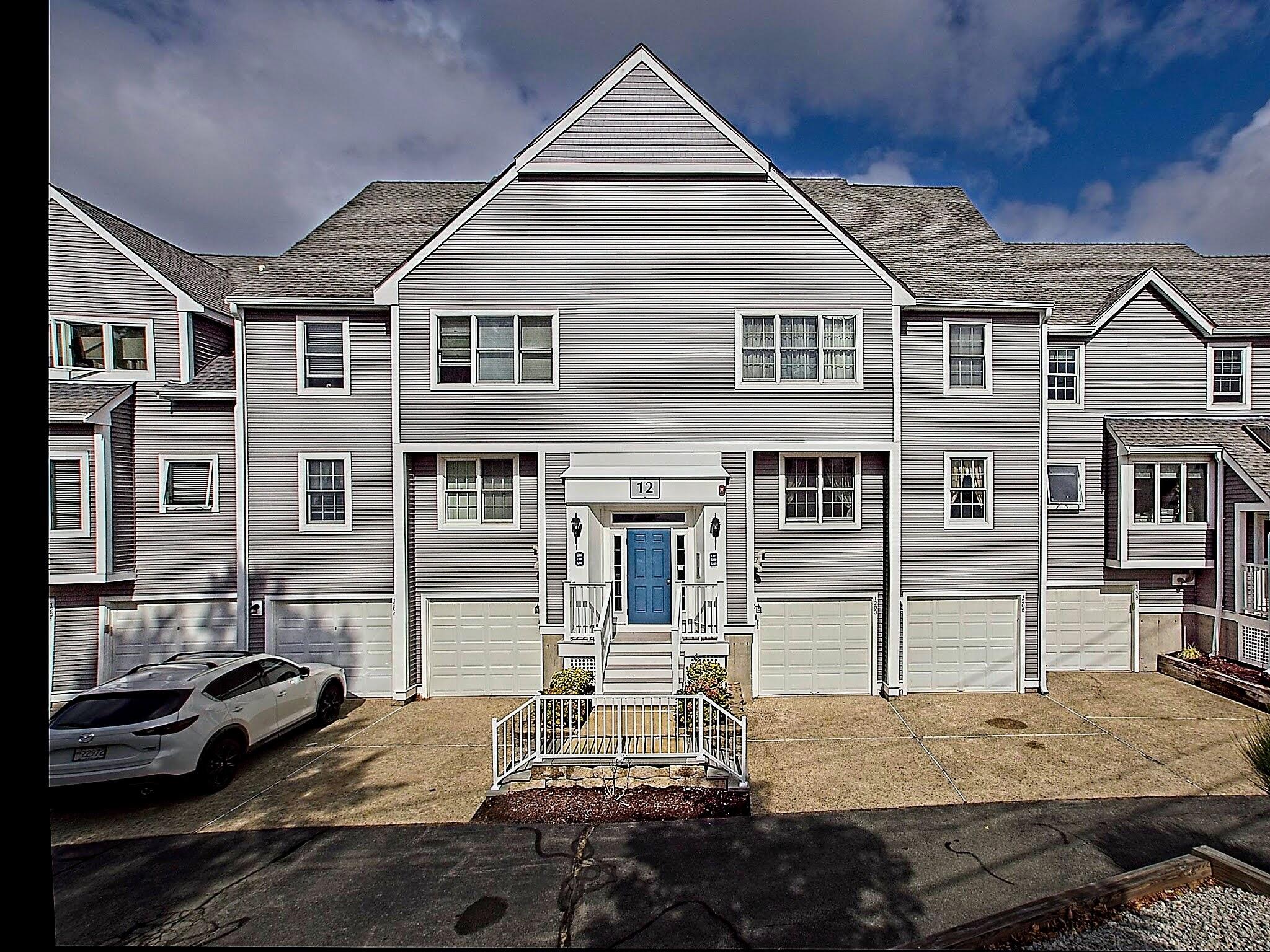 700 Shore Drive, Unit 1205 Fall River, MA 02721 - Photo 2 of 22 a front view of a house with a yard