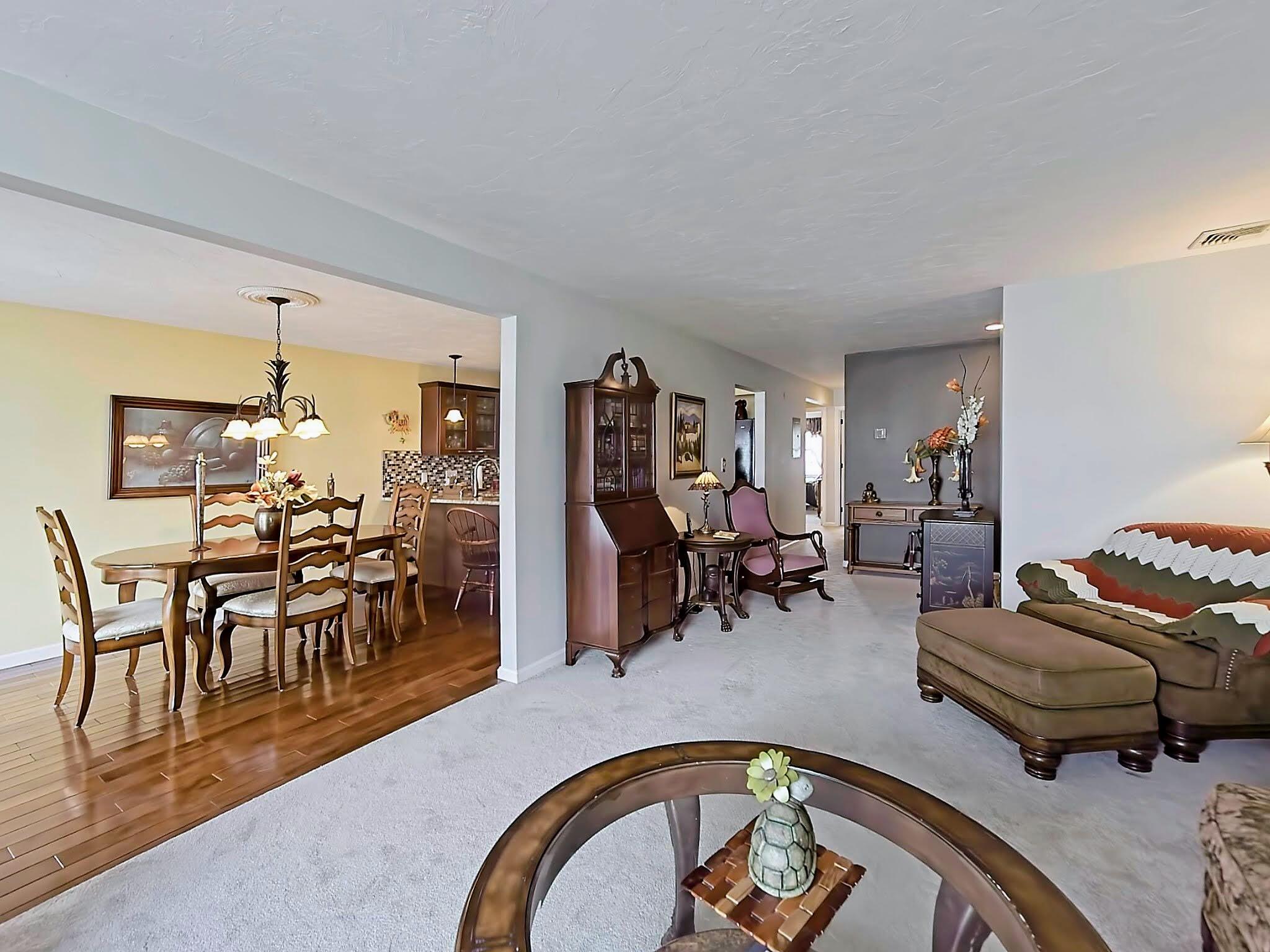 700 Shore Drive, Unit 1205 Fall River, MA 02721 - Photo 6 of 22 a living room with furniture and wooden floor