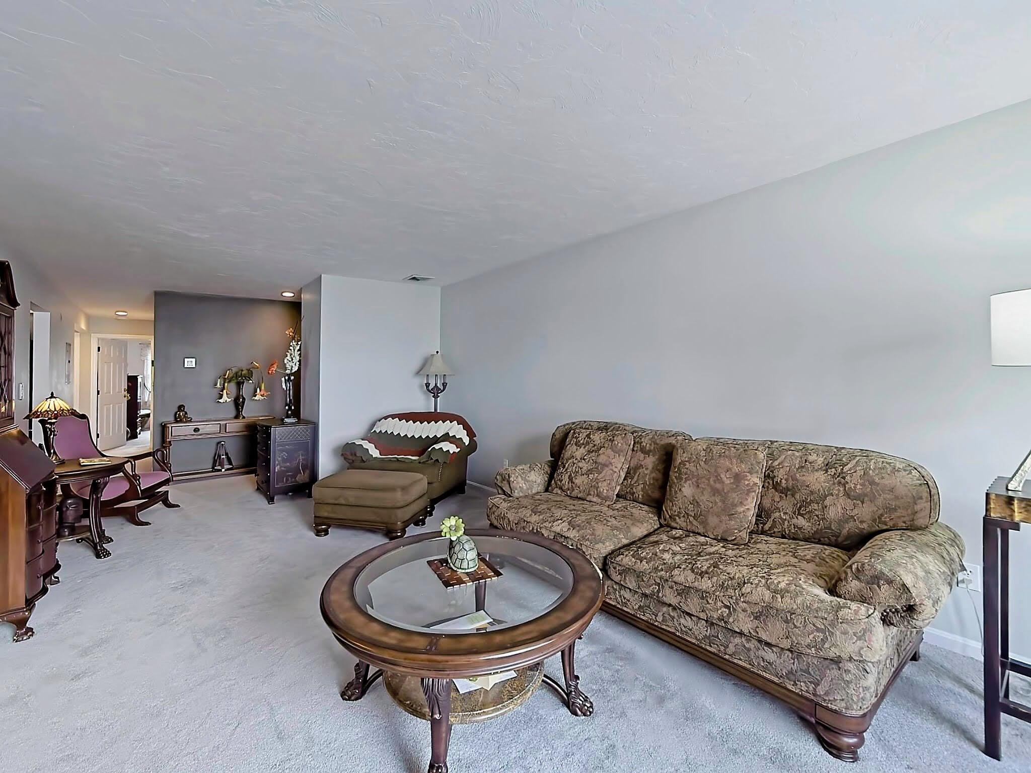 700 Shore Drive, Unit 1205 Fall River, MA 02721 - Photo 7 of 22 a living room with furniture a couch and wooden floor