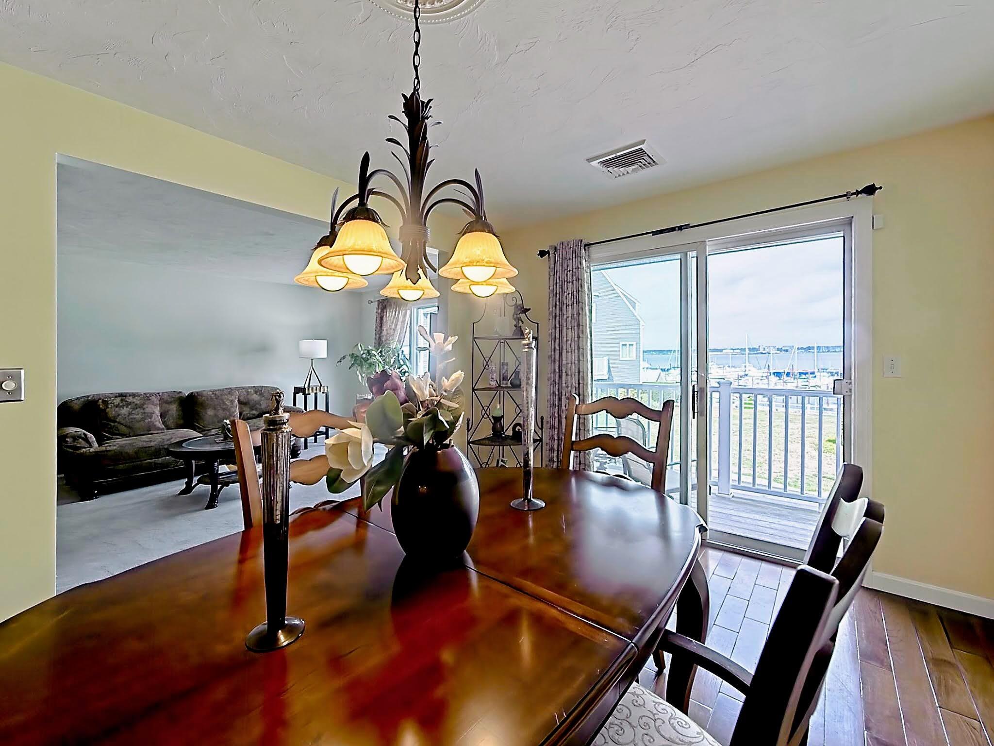 700 Shore Drive, Unit 1205 Fall River, MA 02721 - Photo 10 of 22 a view of a dining room with furniture window and wooden floor