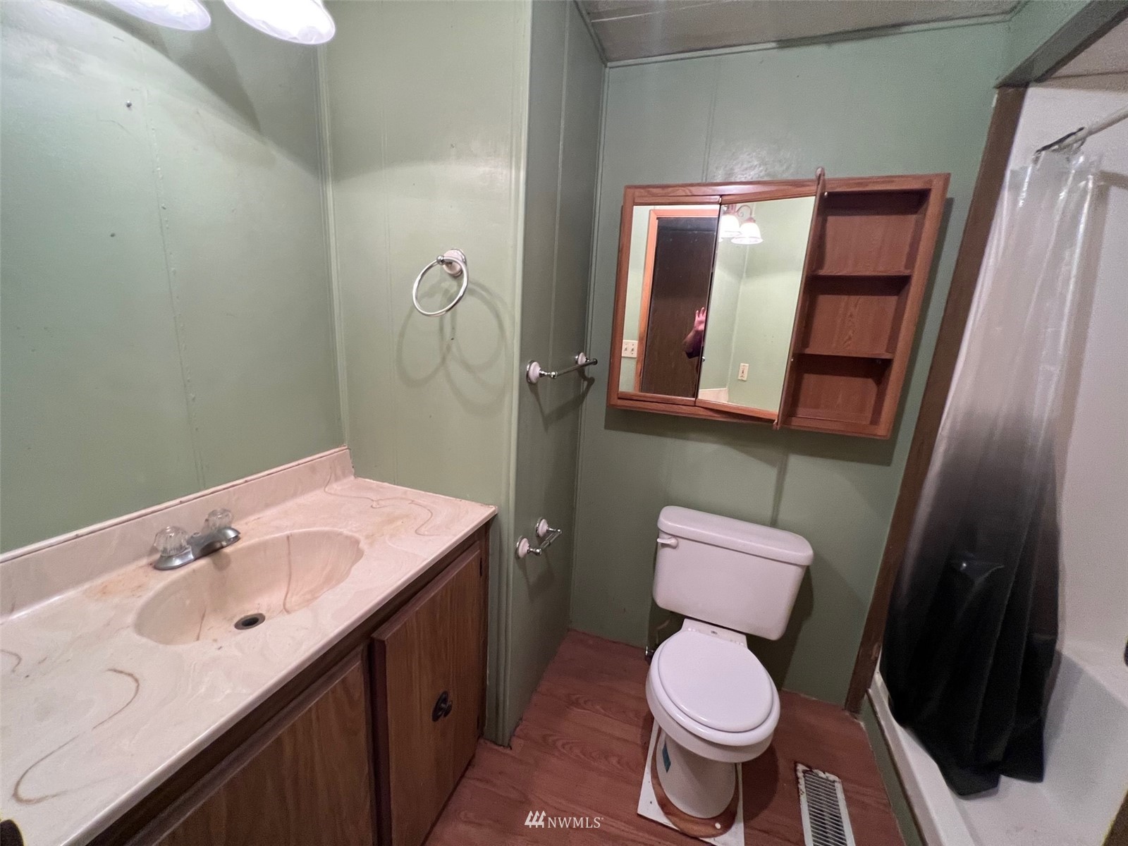 7513 191st Avenue Southwest Rochester, WA 98579 - Photo 8 of 17 a bathroom with a toilet sink and mirror