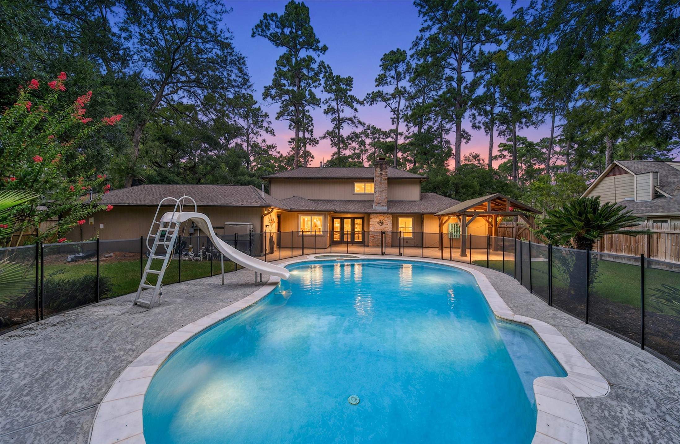 6407 Craigway Road Spring, TX 77389 - Photo 2 of 47 Recently refreshed pool & spa create a backyard retreat, complete with a fun slide and removable child safety fencing.