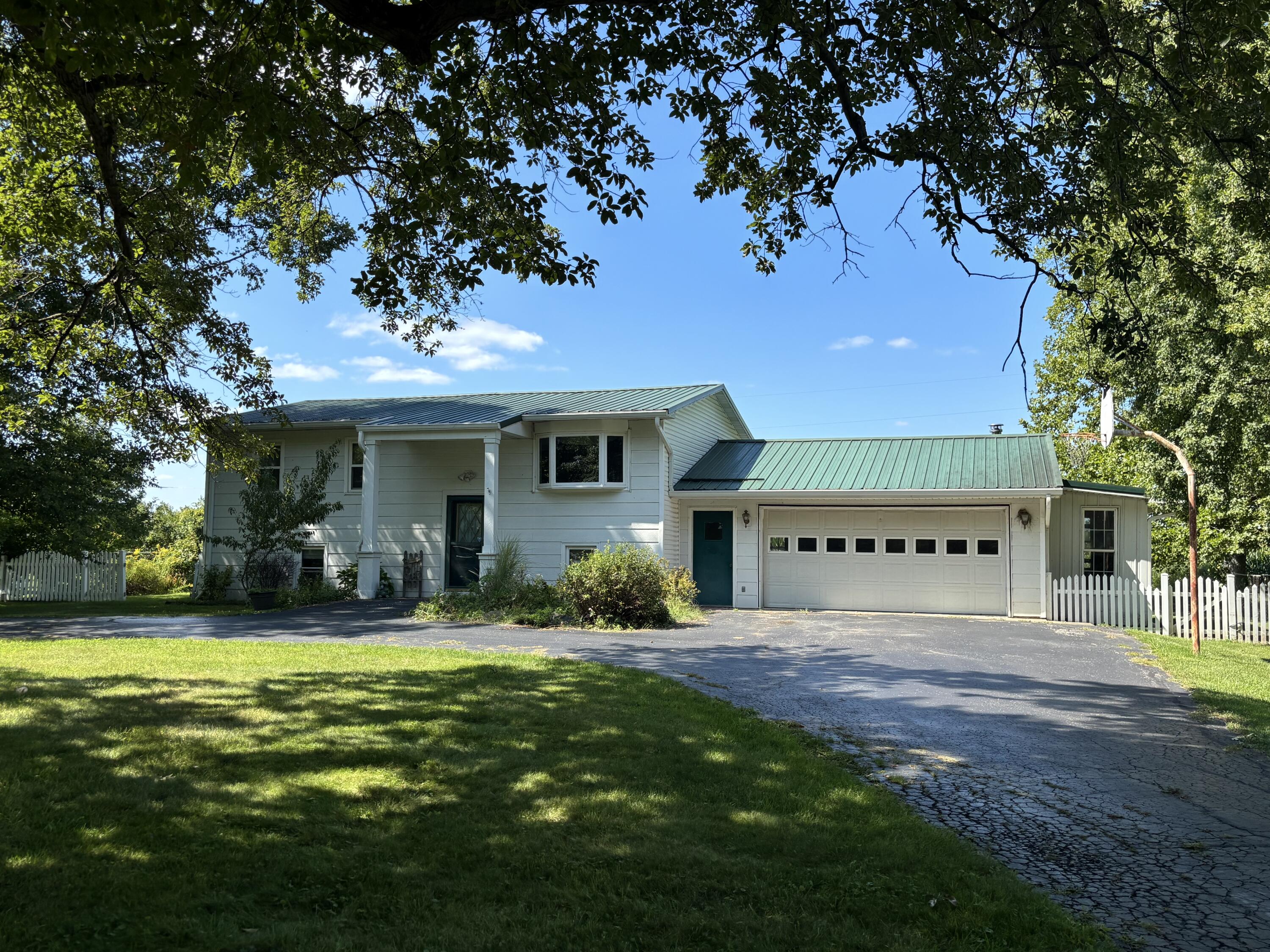 870 Bunkum Road Rensselaer, IN 47978 - Photo 1 of 33 a front view of a house with swimming pool and porch with furniture
