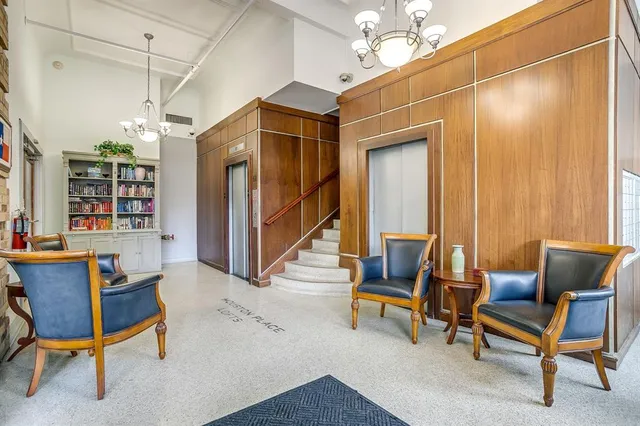 a view of swimming pool with outdoor seating and plants