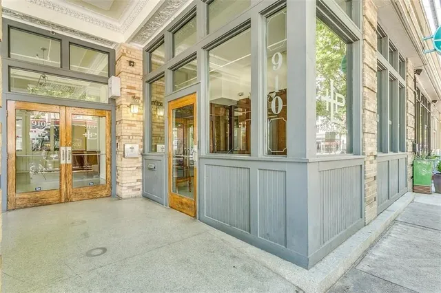 a view of a large building with a glass door