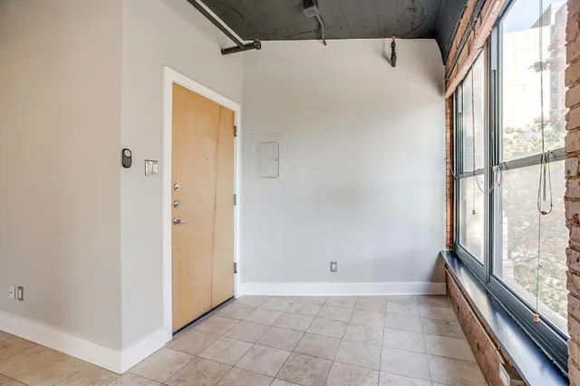 a view of an empty room with a sliding door