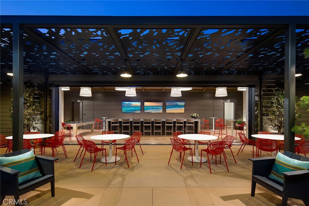 4084 Spring Lane Corona, CA 92883 - Photo 17 of 17 a view of a patio with dining table and chairs with a fire pit