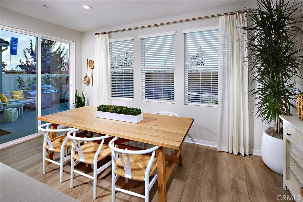 4084 Spring Lane Corona, CA 92883 - Photo 3 of 17 a table and chairs in a room