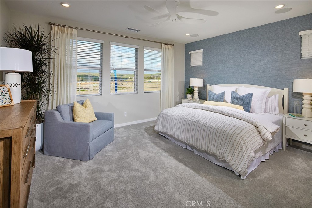 4084 Spring Lane Corona, CA 92883 - Photo 4 of 17 a bedroom with bed and large window