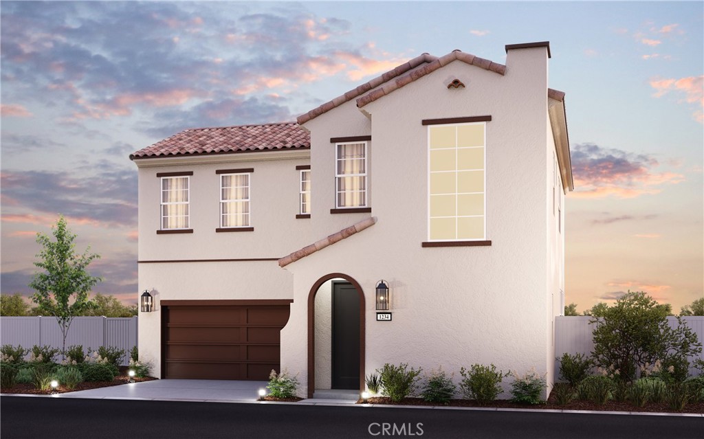 4084 Spring Lane Corona, CA 92883 - Photo 8 of 17 a front view of a house with a garden