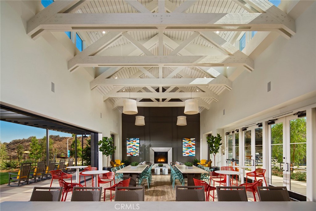 4084 Spring Lane Corona, CA 92883 - Photo 9 of 17 a living room with fireplace furniture and a large window