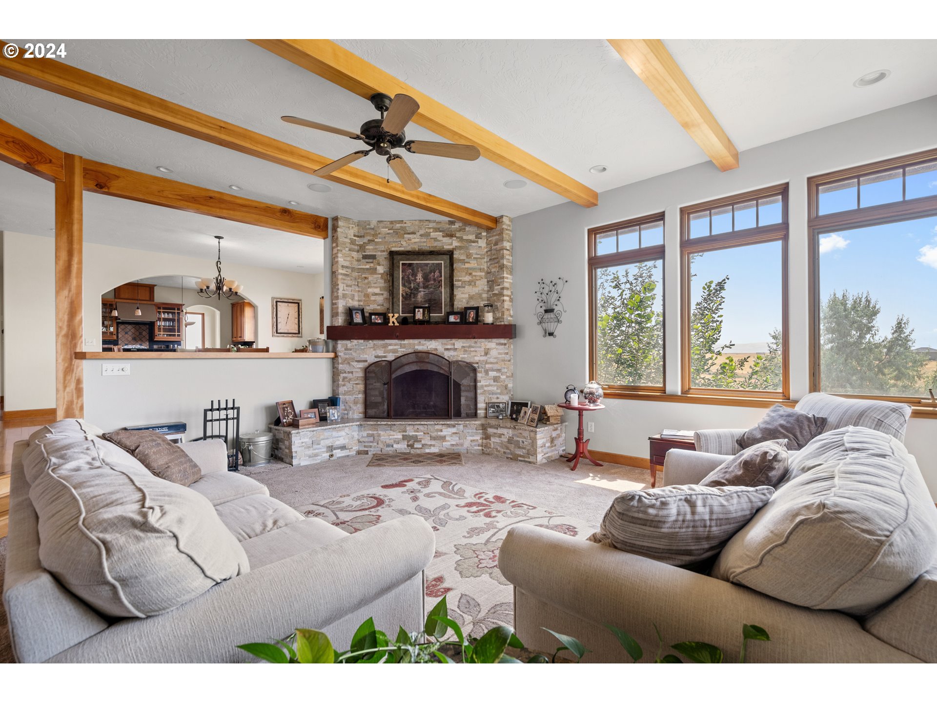 72217 Quill Point Pendleton, OR 97801 - Photo 19 of 48 a living room with furniture a fireplace and a large window