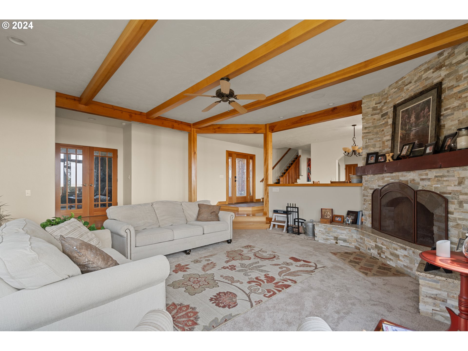 72217 Quill Point Pendleton, OR 97801 - Photo 20 of 48 a living room with furniture a fireplace and a table