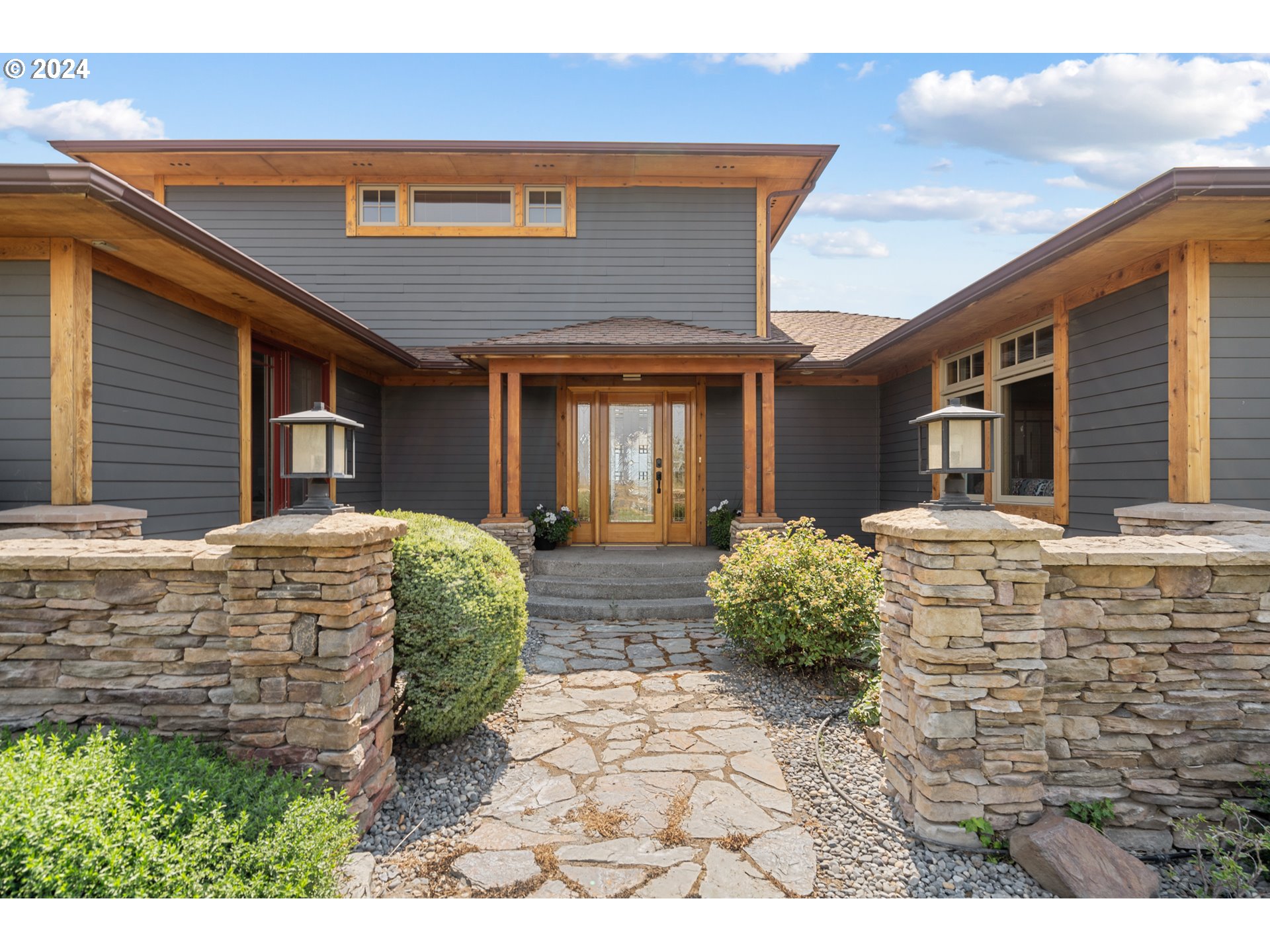 72217 Quill Point Pendleton, OR 97801 - Photo 2 of 48 a front view of a house with garden