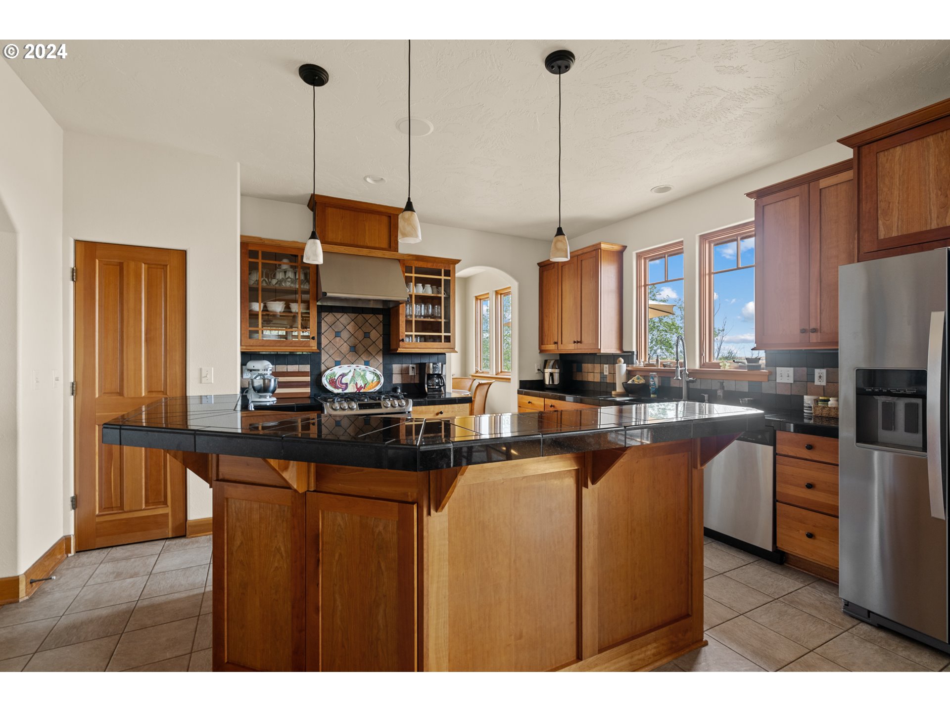 72217 Quill Point Pendleton, OR 97801 - Photo 26 of 48 a kitchen with stainless steel appliances granite countertop a sink a stove and refrigerator