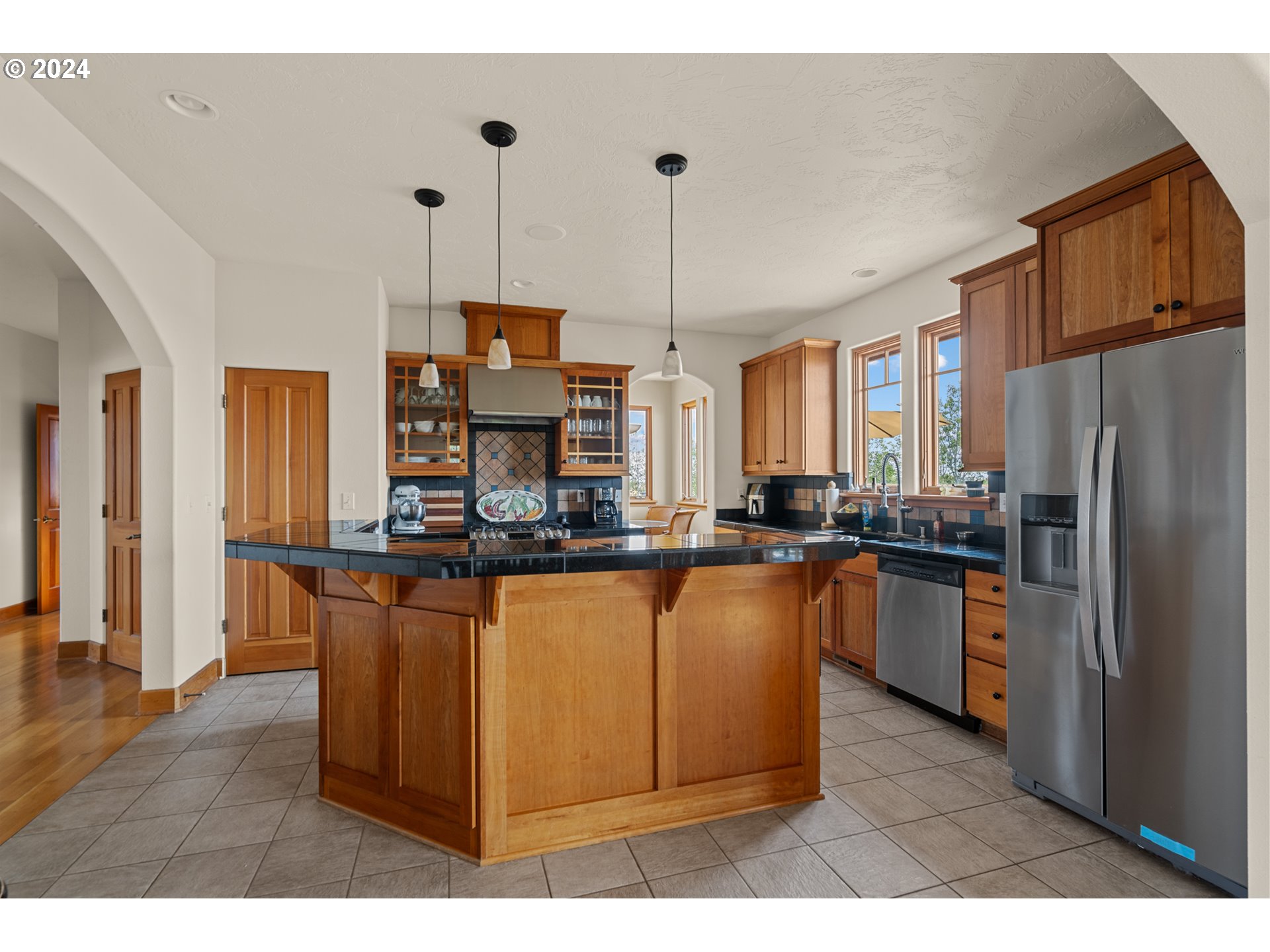 72217 Quill Point Pendleton, OR 97801 - Photo 27 of 48 a kitchen with stainless steel appliances granite countertop a refrigerator a sink dishwasher a stove with wooden floor