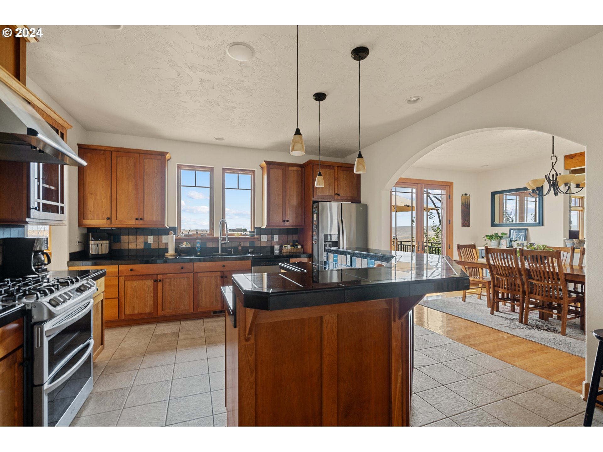 72217 Quill Point Pendleton, OR 97801 - Photo 29 of 48 a kitchen with granite countertop a sink a counter top space appliances and cabinets