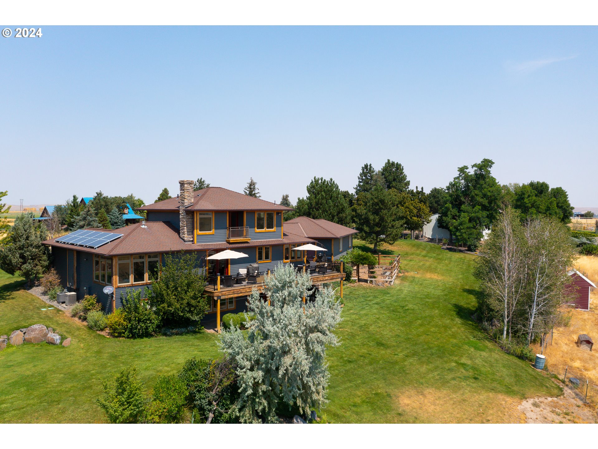 72217 Quill Point Pendleton, OR 97801 - Photo 5 of 48 a view of a house with a yard and sitting area