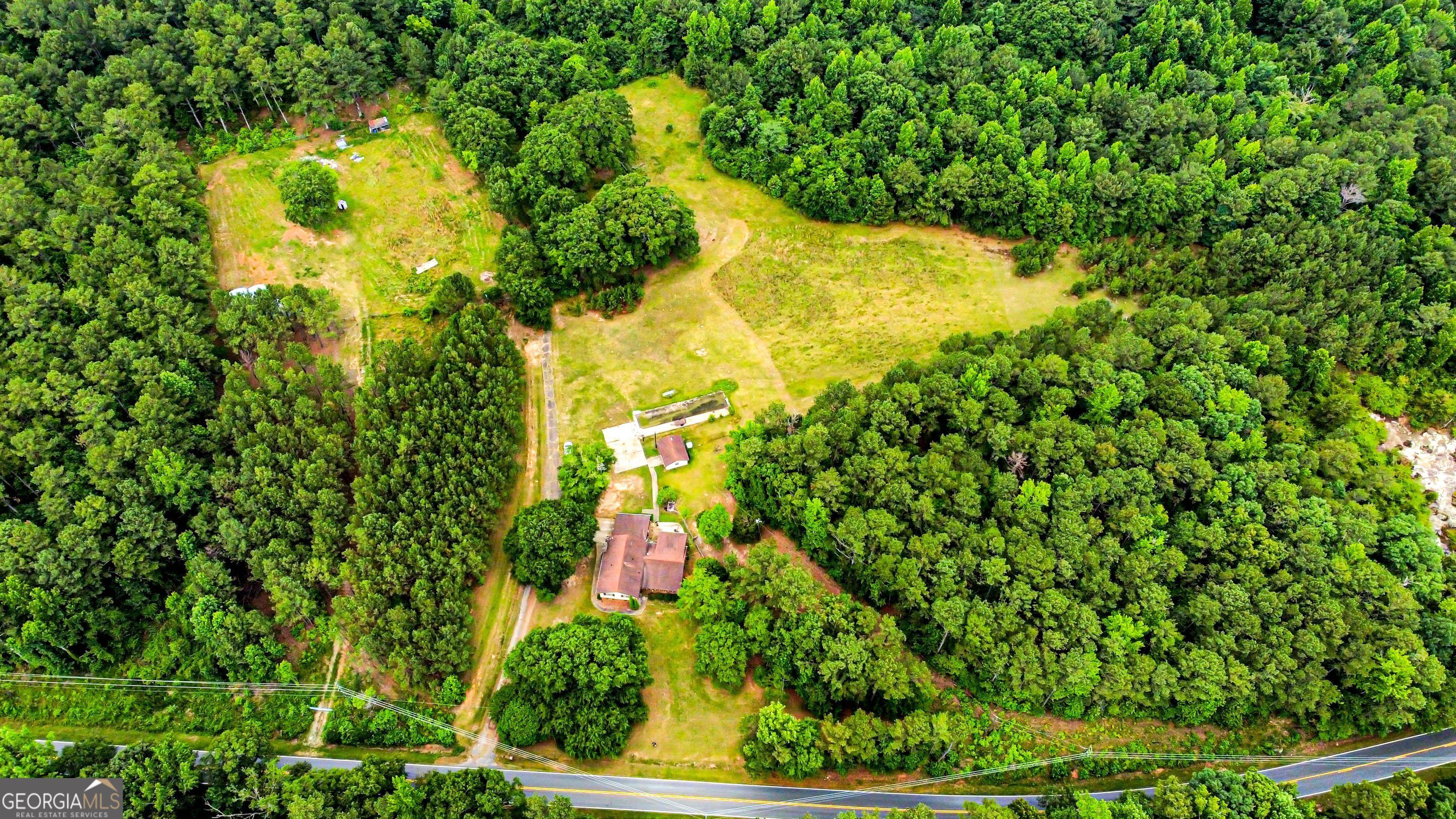 8990 Rivertown Road Fairburn, GA 30213 - Photo 1 of 7 a view of a garden