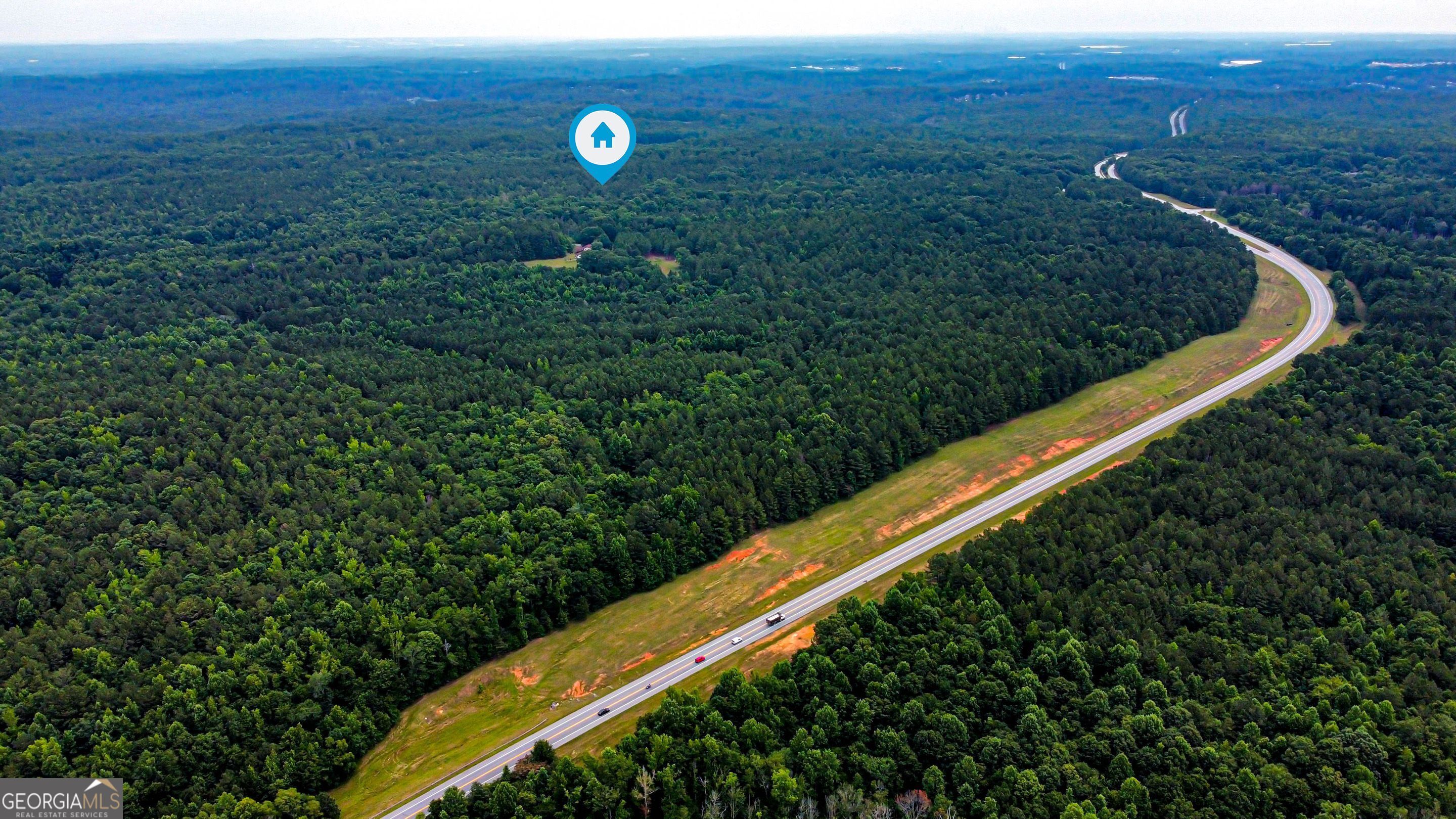 8990 Rivertown Road Fairburn, GA 30213 - Photo 7 of 7 a view of a back yard from a balcony
