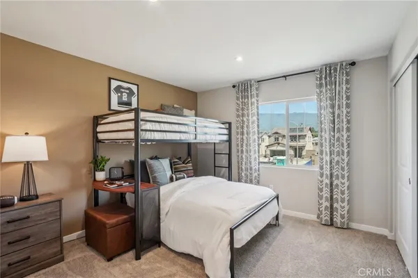 a bed room with a bed and a window