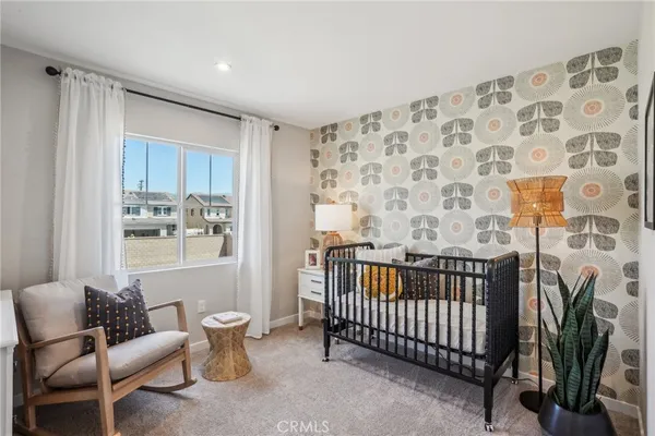 a bedroom with furniture and a window