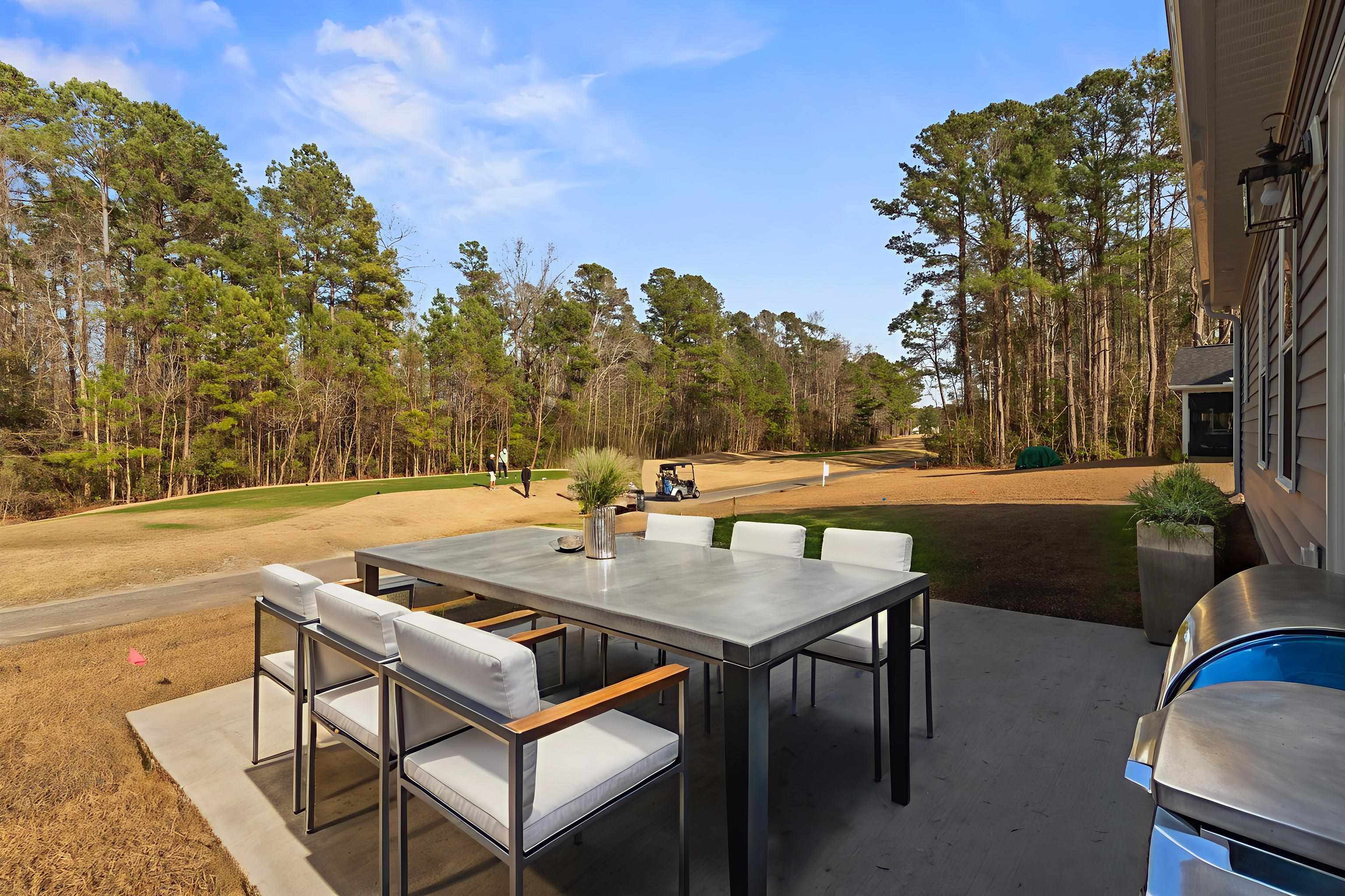 565 Timber Creek Drive Loris, SC 29569 - Photo 32 of 37 View of patio / terrace featuring outdoor dining space, a grill, and view of scattered trees