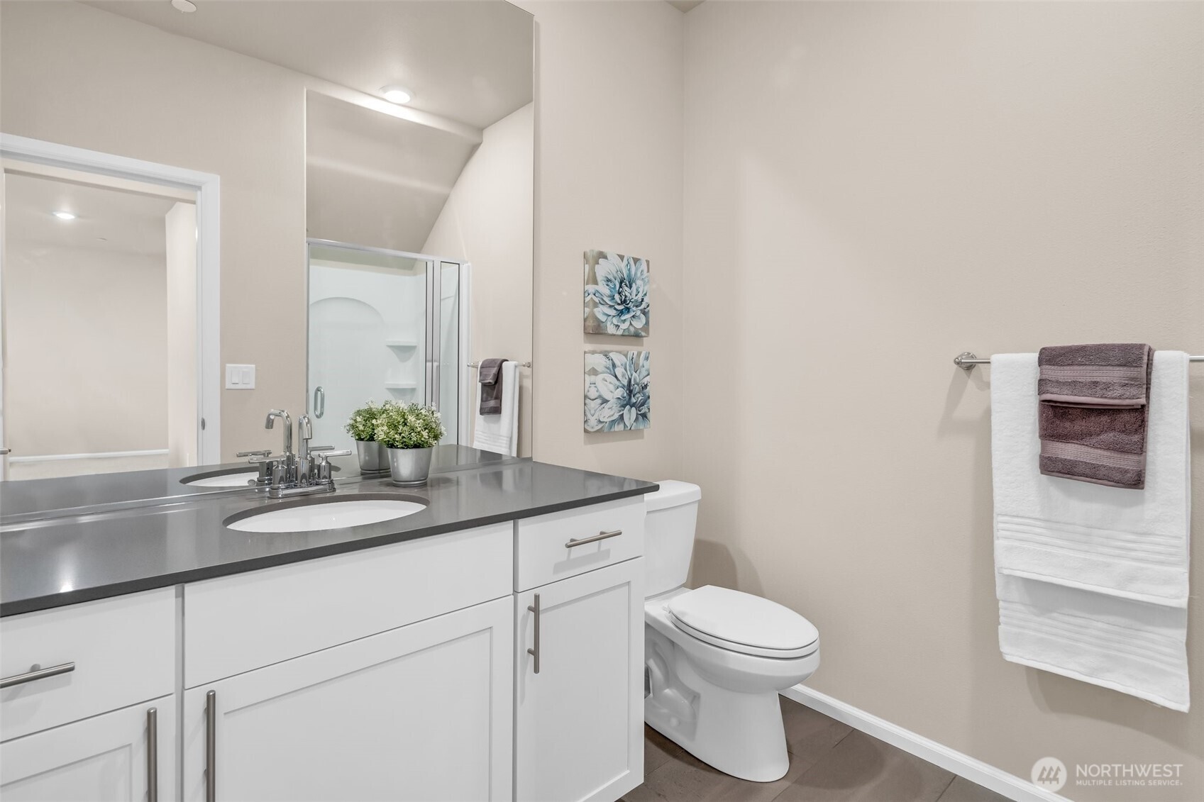 23812 Southeast 291st Street Maple Valley, WA 98010 - Photo 22 of 40 a bathroom with a granite countertop toilet sink and mirror