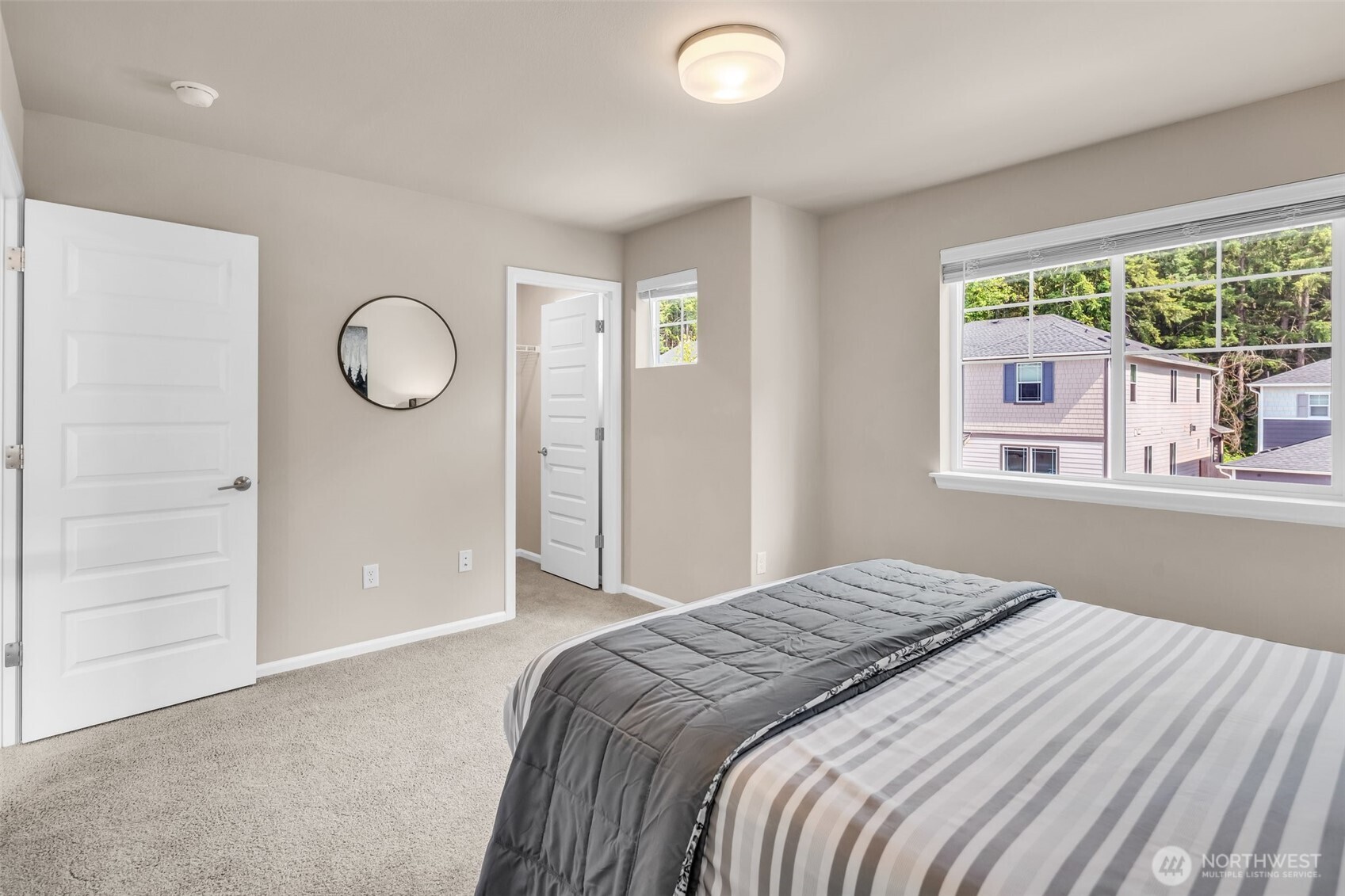 23812 Southeast 291st Street Maple Valley, WA 98010 - Photo 25 of 40 a bedroom with a bed and a window