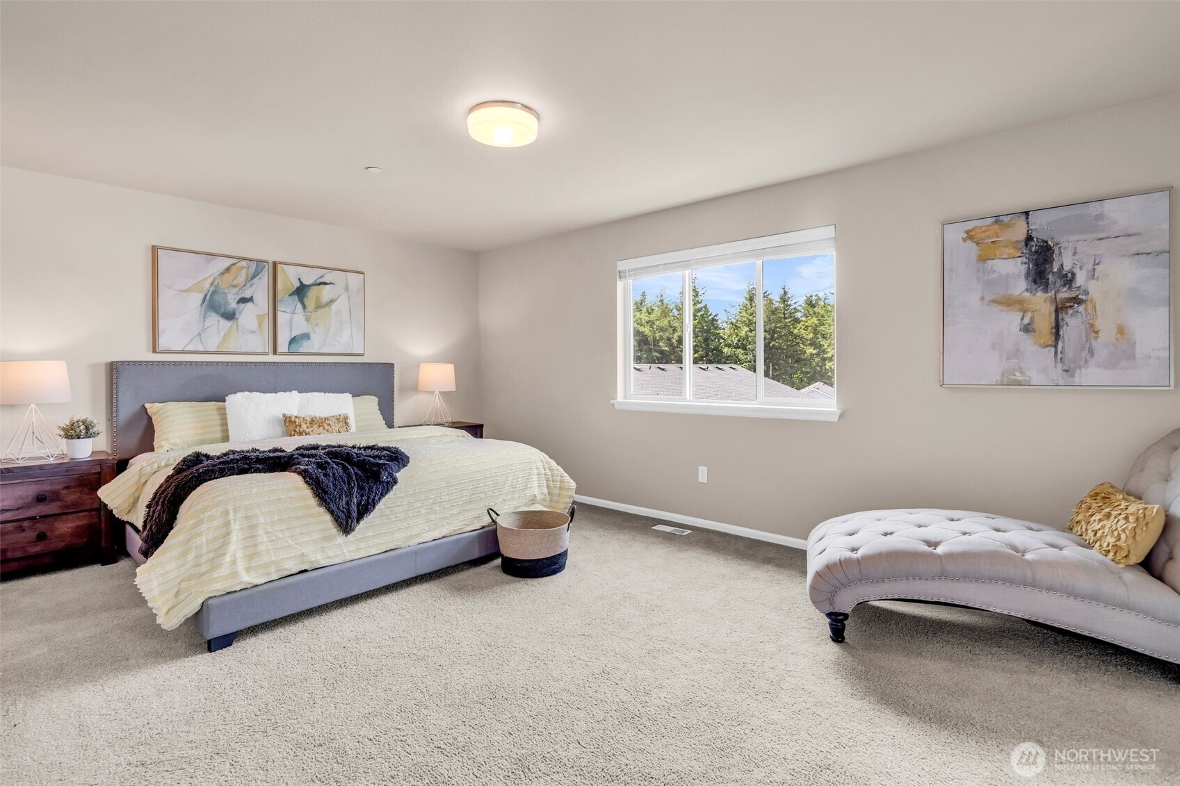 23812 Southeast 291st Street Maple Valley, WA 98010 - Photo 31 of 40 a bedroom with a bed and a painting on the wall