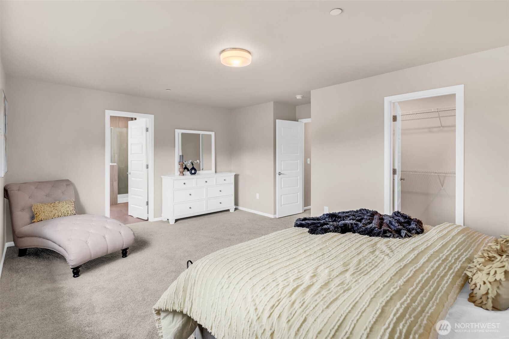 23812 Southeast 291st Street Maple Valley, WA 98010 - Photo 32 of 40 a bedroom with a bed and a couch