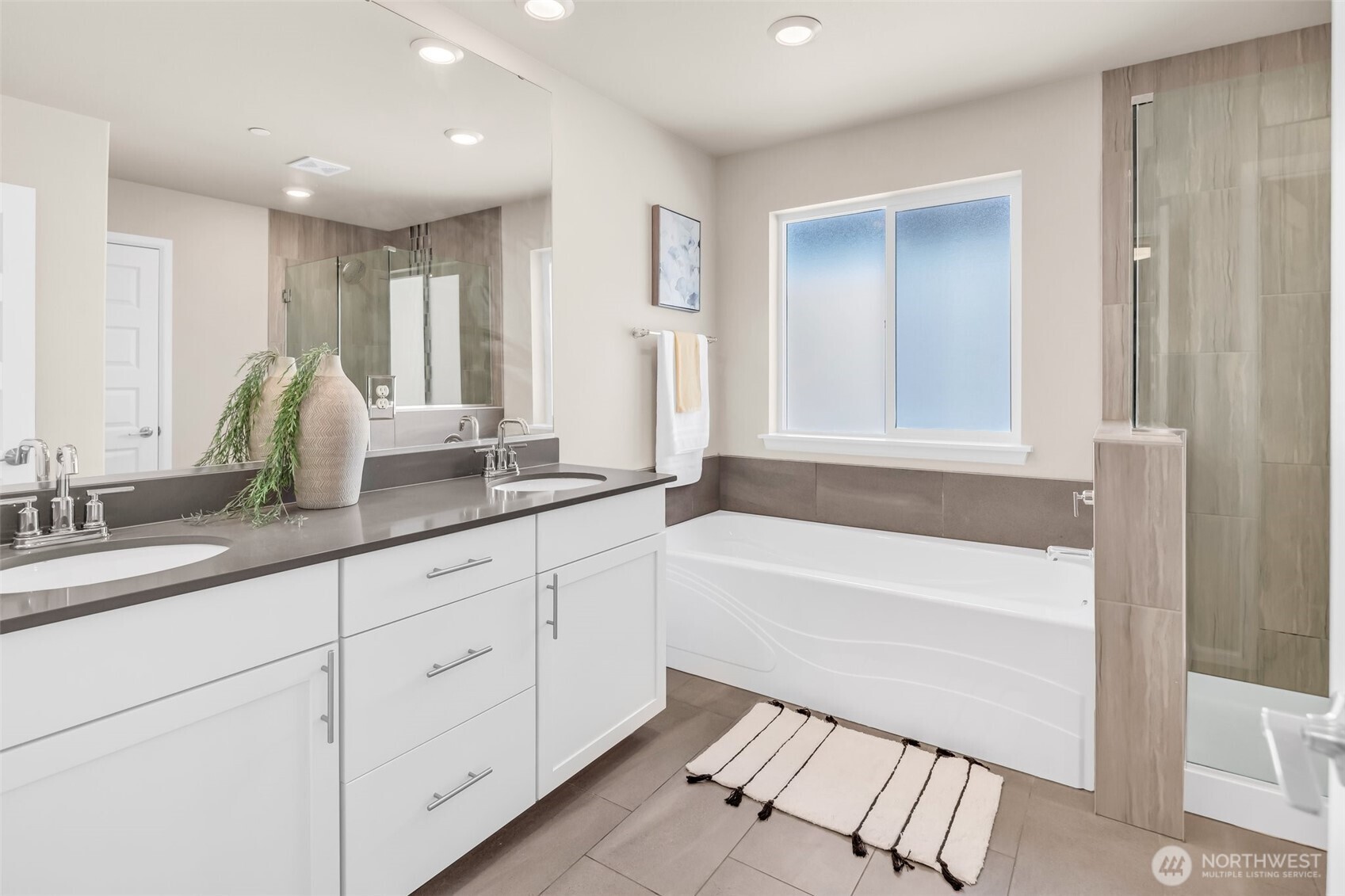 23812 Southeast 291st Street Maple Valley, WA 98010 - Photo 34 of 40 a bathroom with a tub sink and mirror