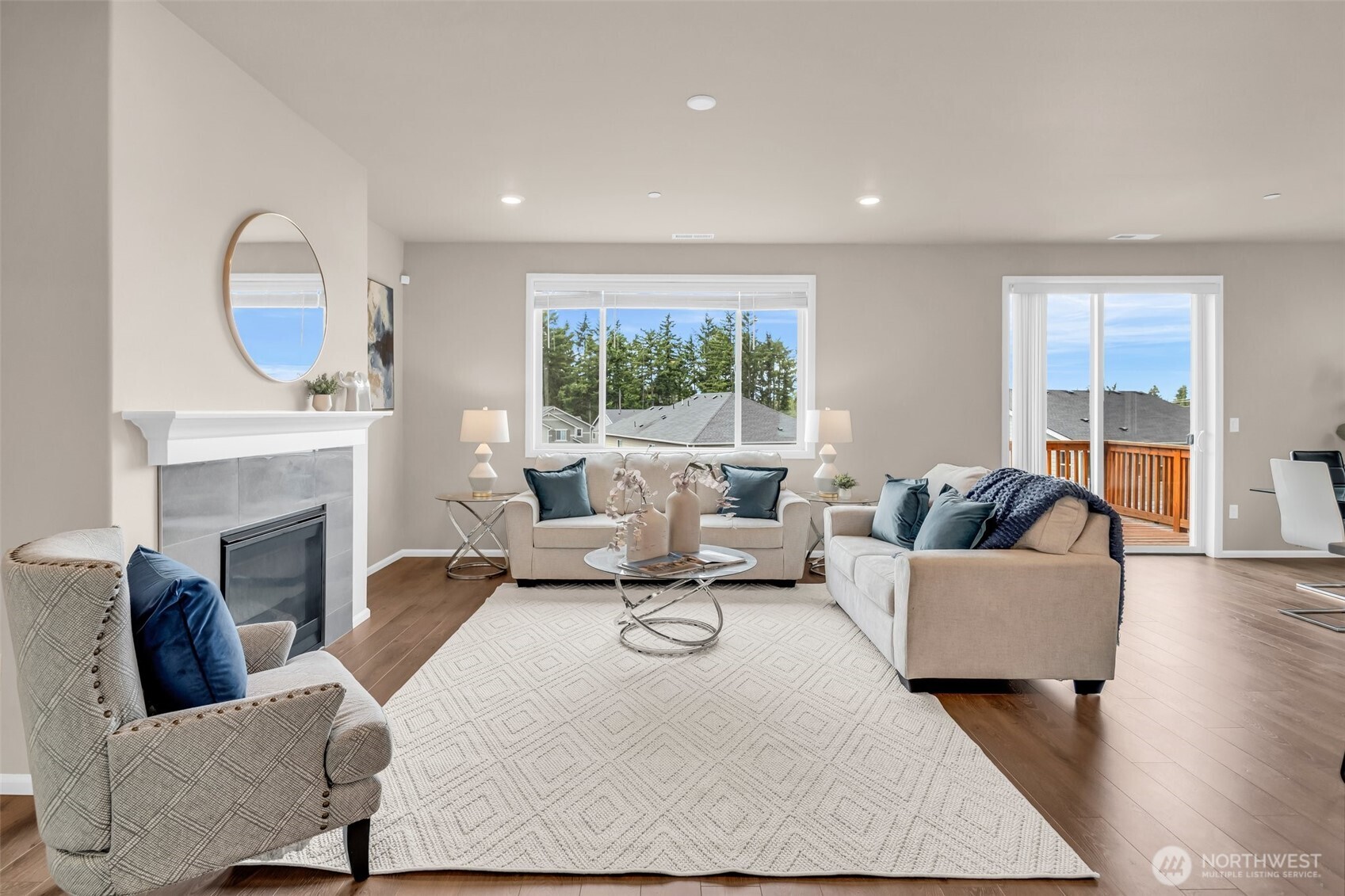 23812 Southeast 291st Street Maple Valley, WA 98010 - Photo 7 of 40 a living room with fireplace furniture and a large window
