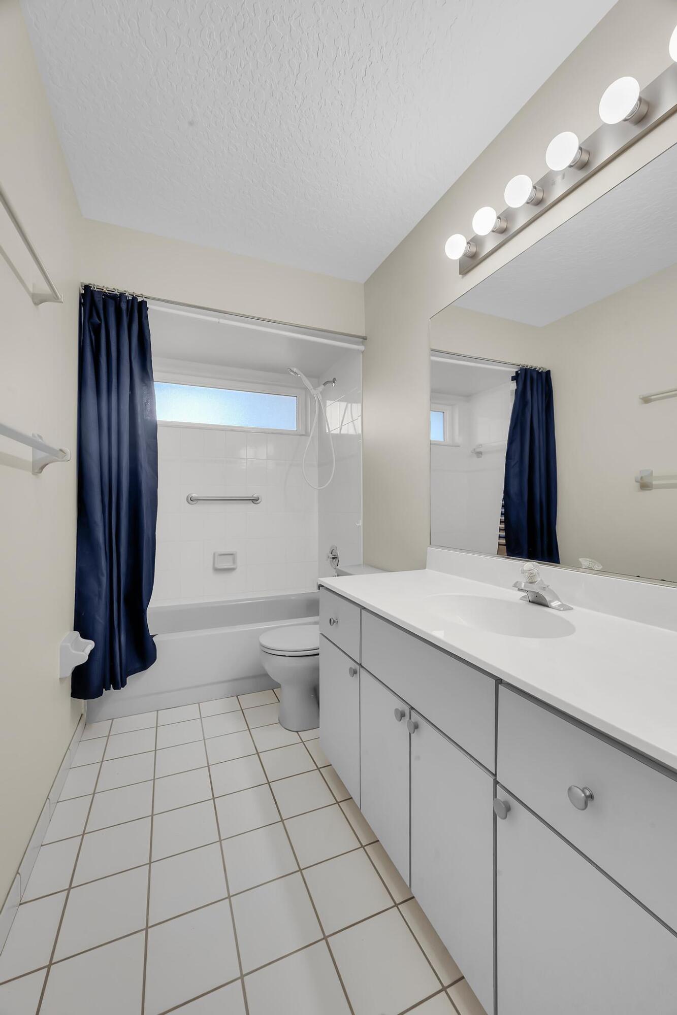 8330 Hidden Pines Road Fort Pierce, FL 34945 - Photo 30 of 34 a bathroom with a toilet and a shower