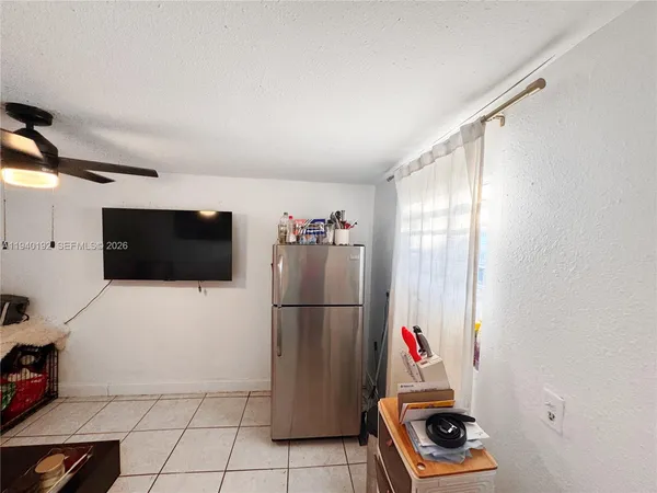 a living room with a couch and a flat screen tv