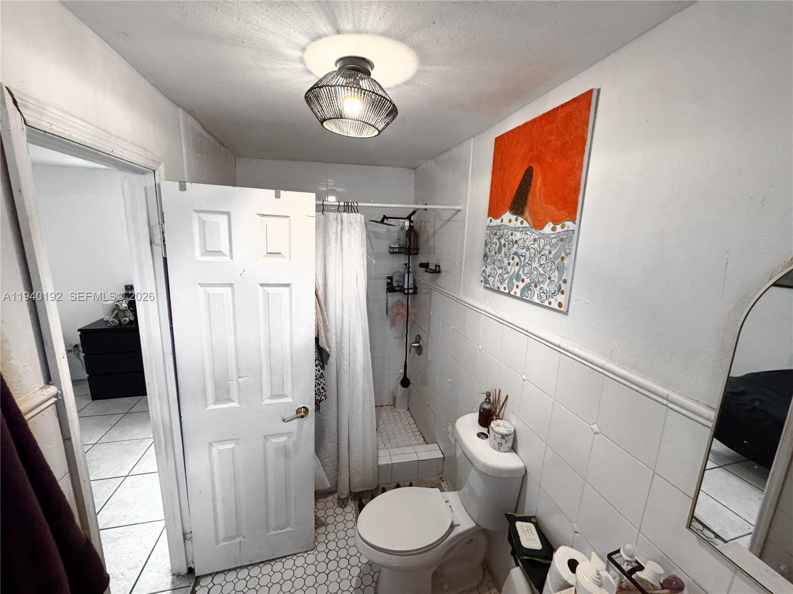 195 Northwest 135th Street Miami, FL 33168 - Photo 5 of 7 a bathroom with a toilet sink and shower