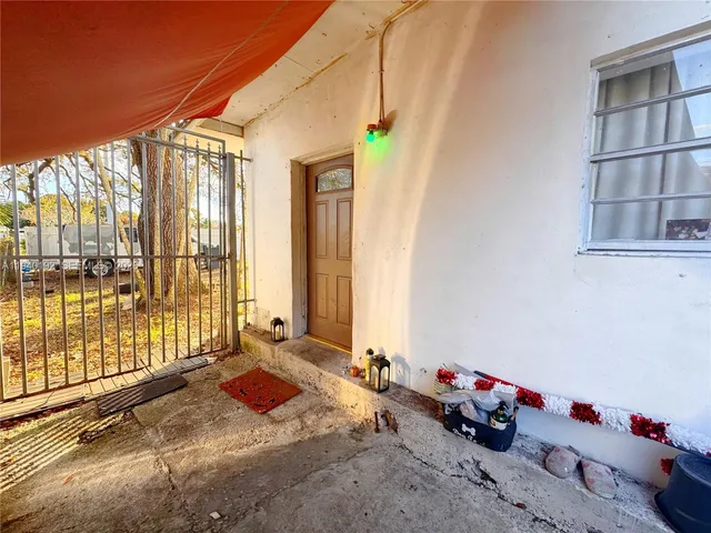 a bedroom with bed and glass door