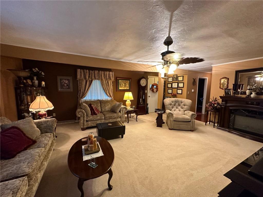 696 Leighty Hollow Road Ruffs Dale, PA 15679 - Photo 12 of 46 a living room with furniture a chandelier and couch