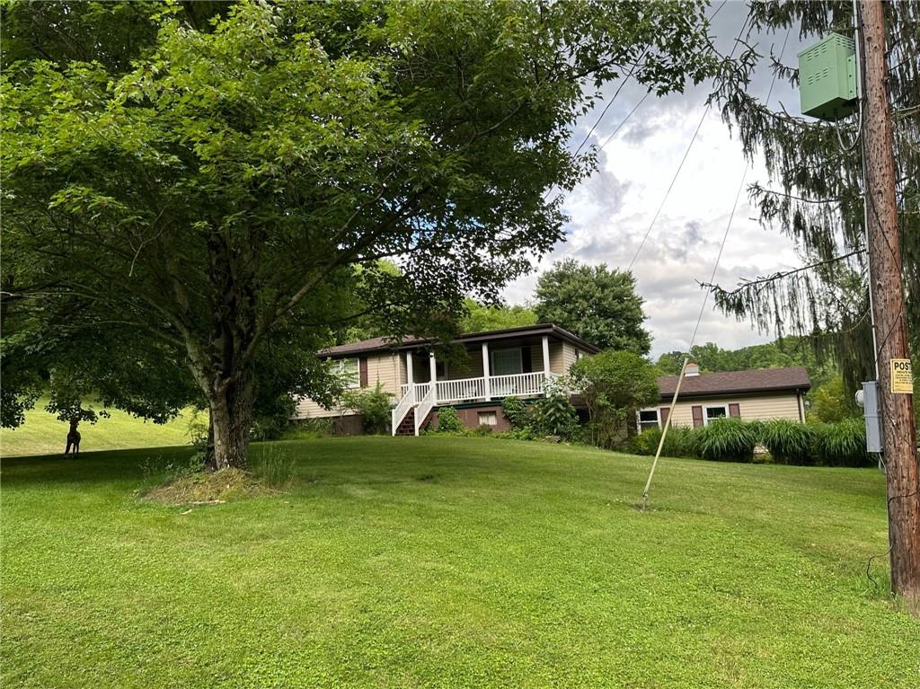 696 Leighty Hollow Road Ruffs Dale, PA 15679 - Photo 2 of 46 a view of a house with backyard