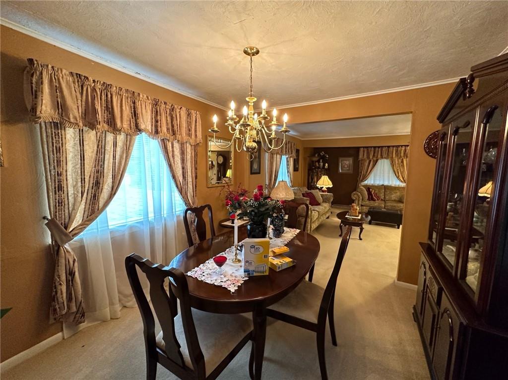 696 Leighty Hollow Road Ruffs Dale, PA 15679 - Photo 21 of 46 a view of a dining room with furniture and window