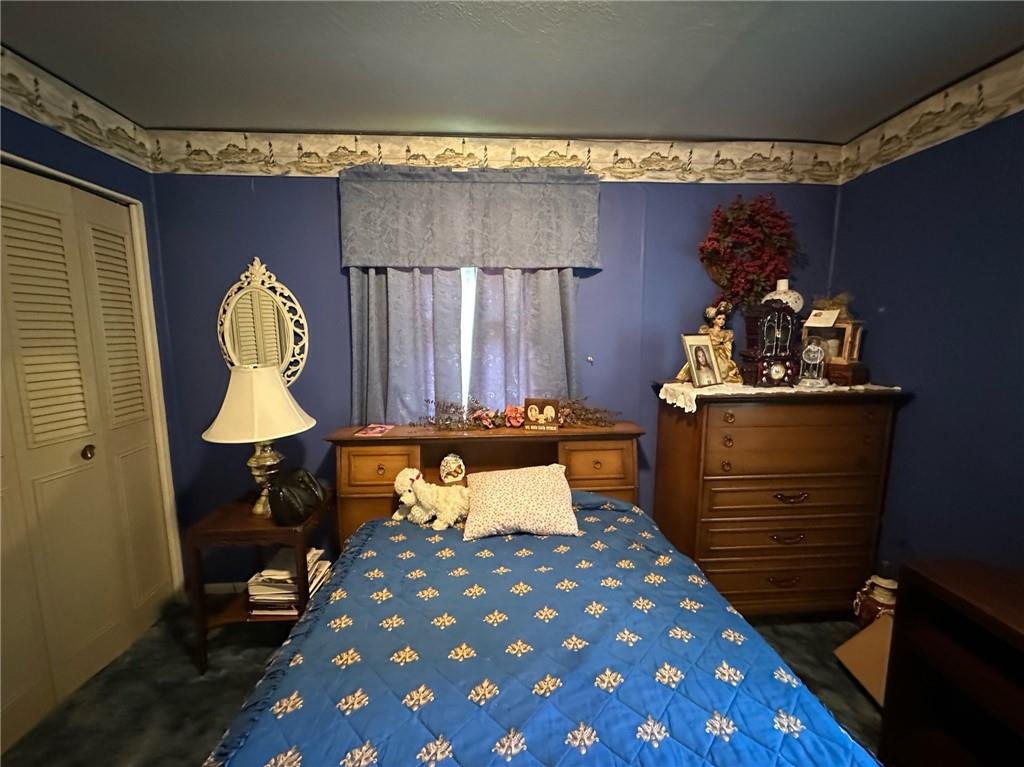 696 Leighty Hollow Road Ruffs Dale, PA 15679 - Photo 25 of 46 a bed room with a bed and a lamp